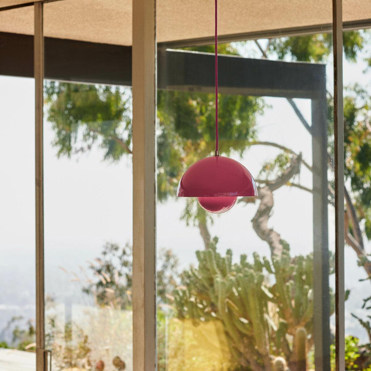 The Flowerpot VP1 pendant by &Tradition suspended in a modern room, offering ambient light.