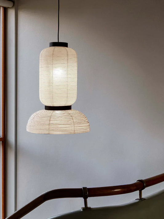 Sculptural paper pendant light creating a soft warm glow in a modern Scandinavian interior