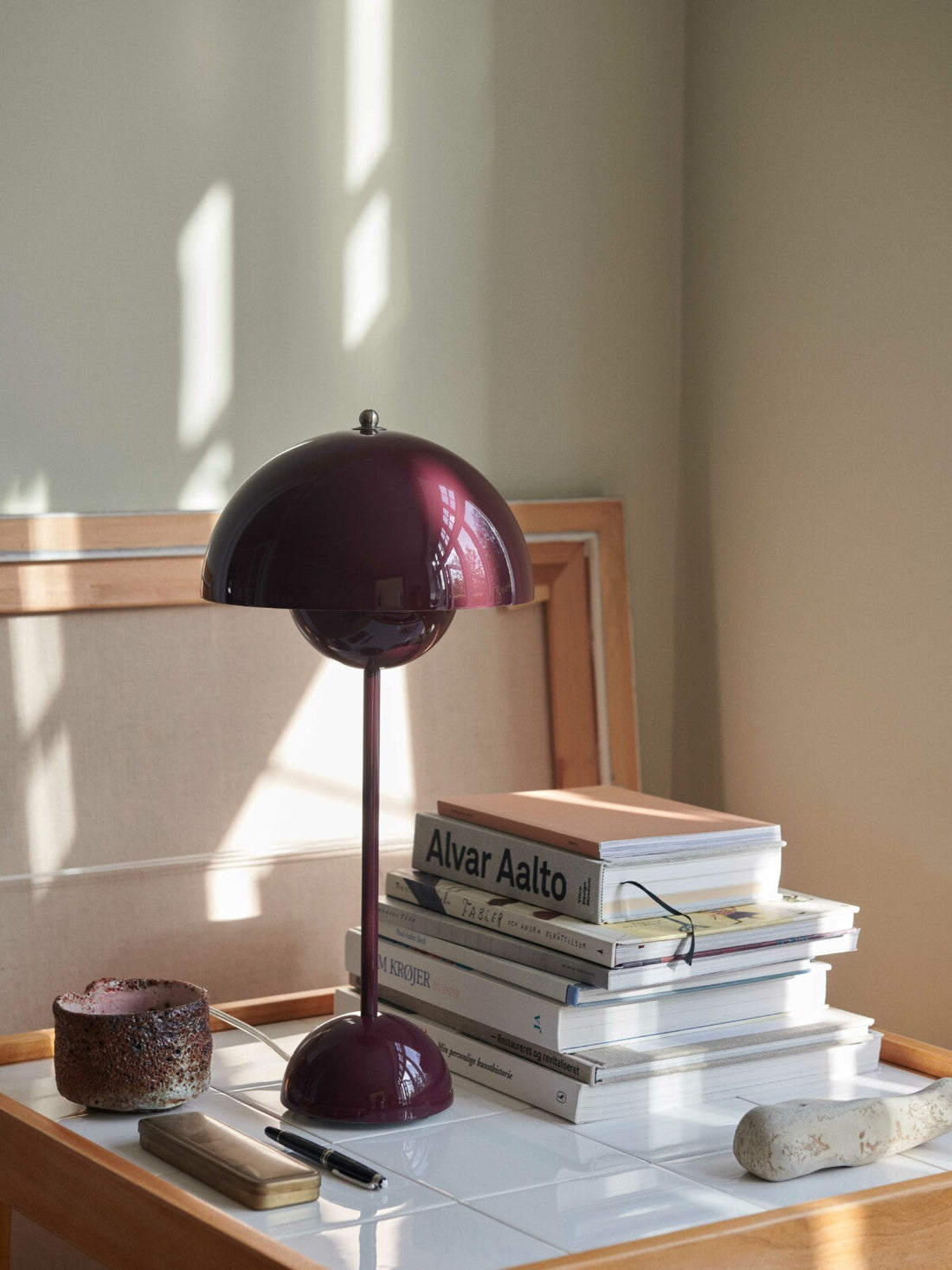 Flowerpot VP3 Table Lamp by &Tradition in vibrant colors on a modern side table – iconic mid-century lighting design