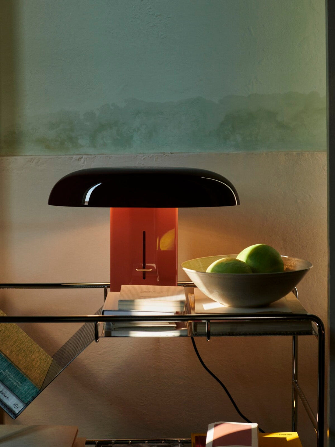 Close-up of the Montera lamp showcasing its sleek base and gracefully curved shade.