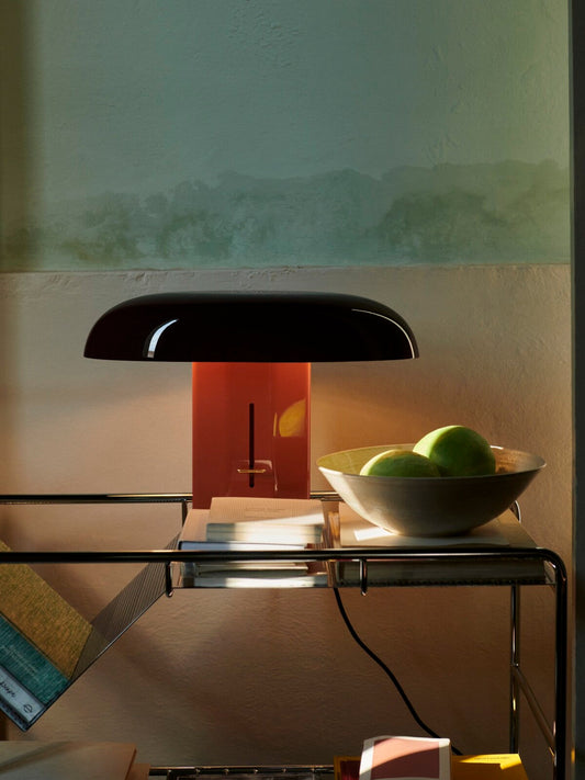 Close-up of the Montera lamp showcasing its sleek base and gracefully curved shade.