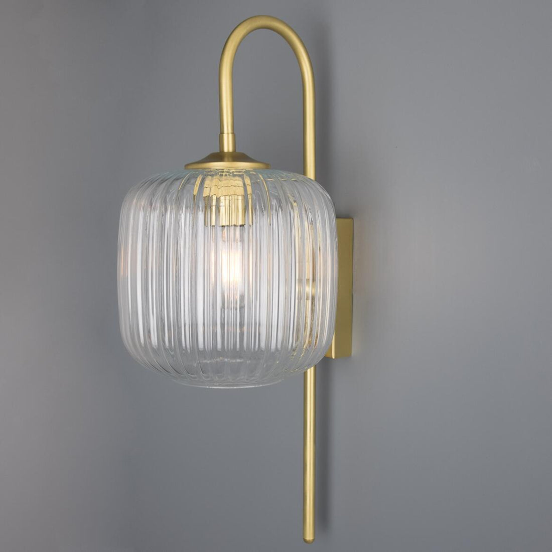 Astoria Brass Wall Lamp by Mullan Lighting – mid-century modern wall light with reeded glass shade and brass frame, luxury lamp for elegant interiors.