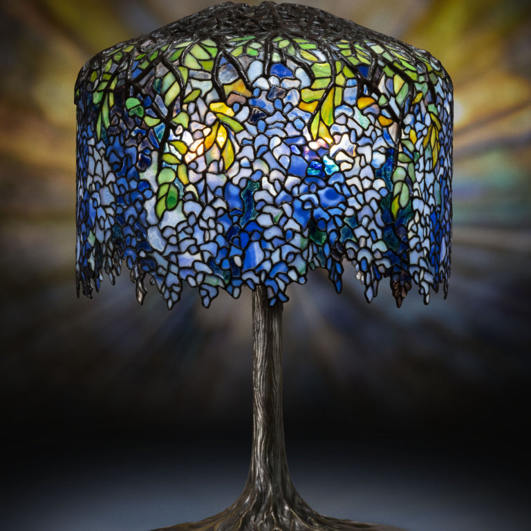 Wisteria lamp with intricate floral glass design, representing luxury home decor and premium designer lighting.