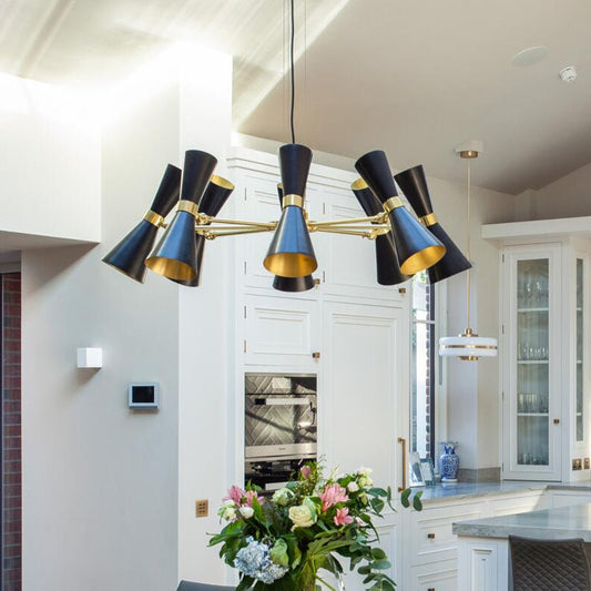 Modern kitchen with a stylish chandelier, dining table, and chairs.