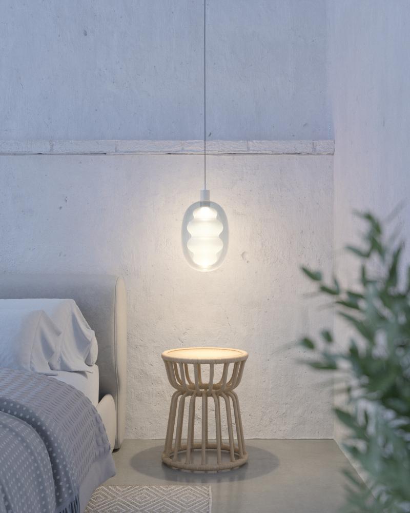 Modern living room lit with warm ambient lighting, featuring designer fixtures that enhance sleep and well-being.