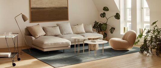 Living room designed with Gubi's Floor lamp, Gubi Sofa and Lounge chair giving scandi cozy vibes