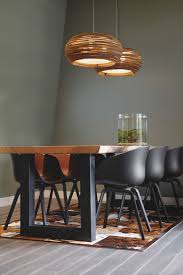 Farmhouse living room featuring pendant lights, wooden accents, warm ambiance.