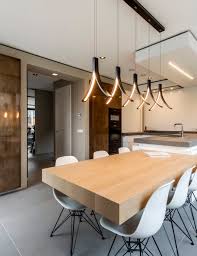 Elegant pendant lights illuminating a modern living room with luxury and designer home décor.