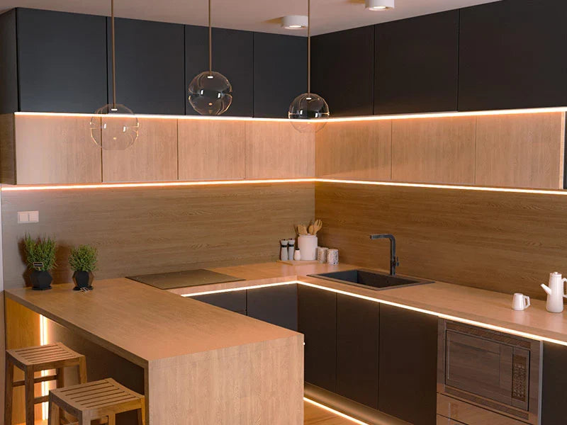 Modern luxury kitchen with warm LED under-cabinet lighting, Scandinavian designer pendants, premium European fixtures, and elegant contemporary cabinetry.