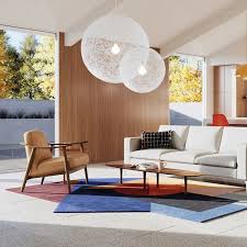 Alt Text: Modern living room with symmetrical furniture arrangement and ambient lighting.