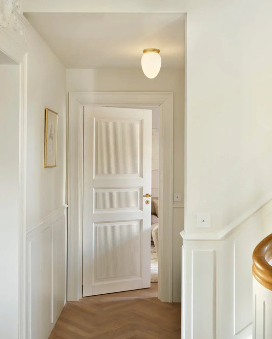 Elegant organic-shaped ceiling light by Nuura for modern spaces