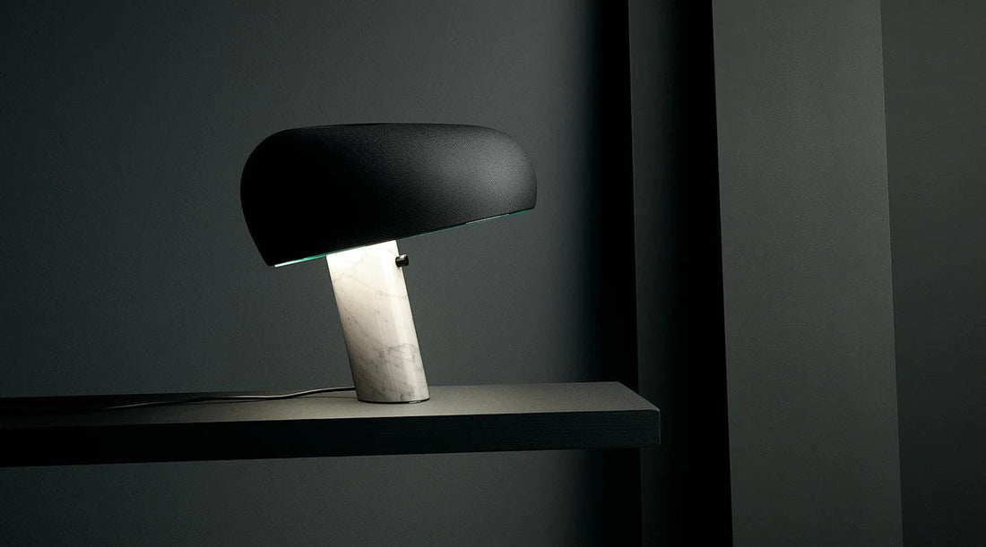 Snoopy lamp with a curved glossy top and marble base, representing playful yet premium Italian designer lighting for stylish interiors.
