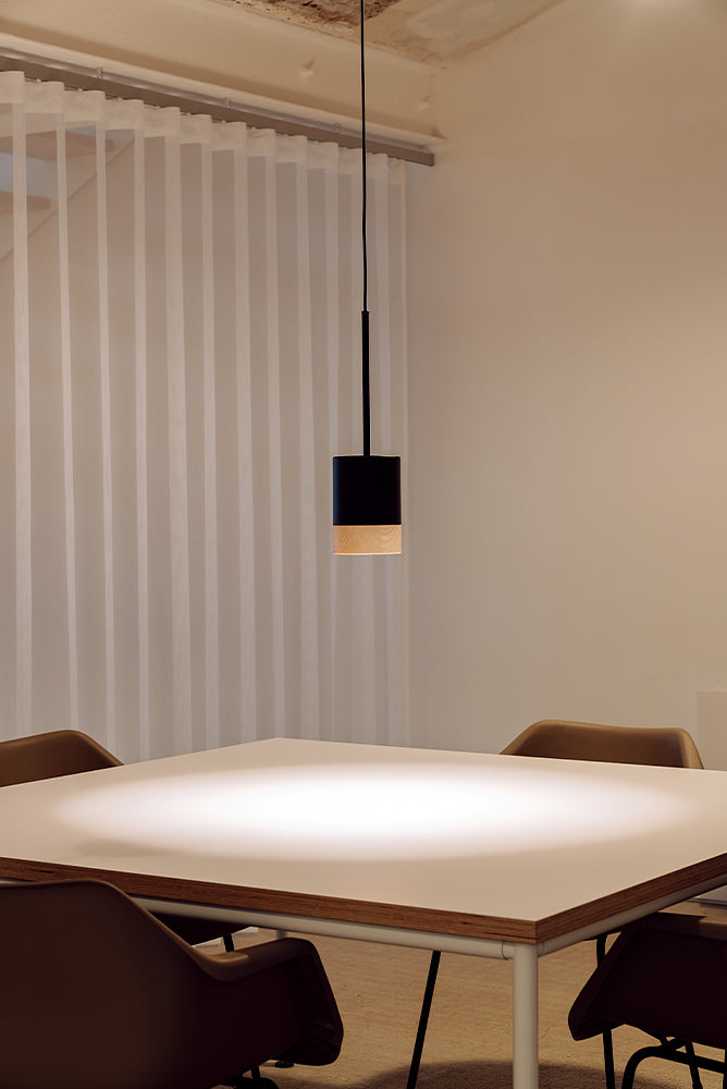 Human-centric lighting in a sophisticated modern home, combining warm and cool layered illumination with designer pendants and ambient lighting.