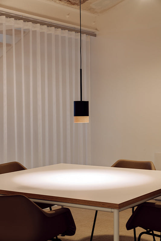 Human-centric lighting in a sophisticated modern home, combining warm and cool layered illumination with designer pendants and ambient lighting.