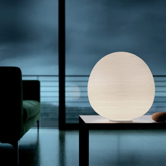 Elegant Scandinavian designer table lamp styled in a modern luxury bedroom with warm ambient lighting and sophisticated wedding gift aesthetic.