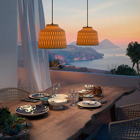 Bover Barcelona designer pendant lights in a luxurious coastal apartment with warm Mediterranean style interiors.