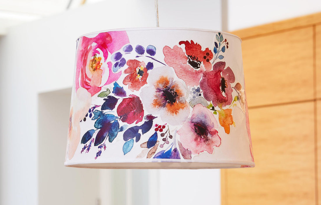 Refreshed fabric lampshade on modern table lamp casting warm ambient light in stylish living room interior.