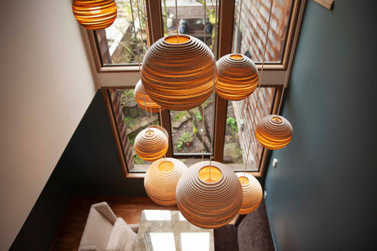 Graypants Scraplights pendant made from recycled cardboard in a modern luxury interior with warm textured ambient lighting.