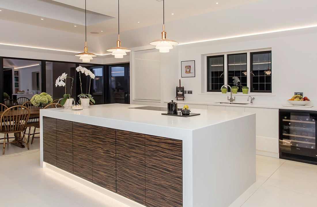 Modern kitchen island styled with hanging pendant lights, warm ambient lighting, and sleek finishes blending functionality and style.