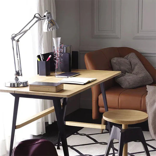 Modern Scandinavian-inspired home office with ergonomic lighting, designer task lamp, ambient pendant lights, and productivity-focused workspace design.