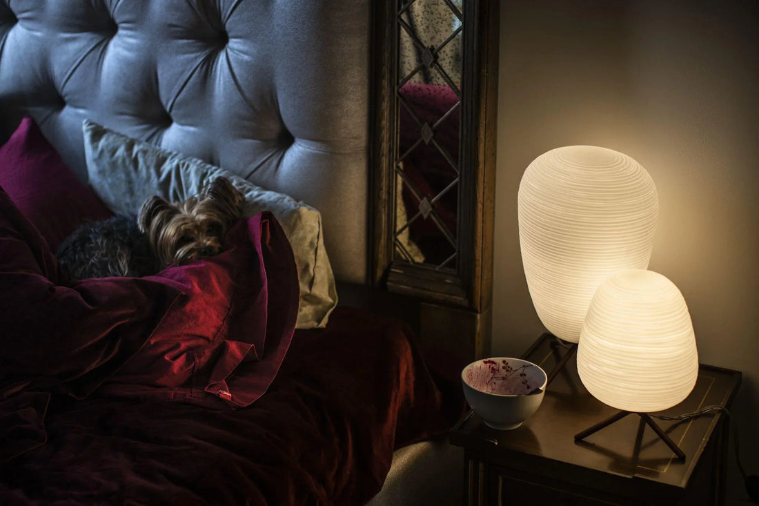 Guest bedroom styled with warm bedside lamps, soft ceiling lighting, and elegant wall lamps creating a cozy atmosphere.