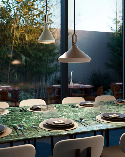 Discover how to light an outdoor dining area with warm pendant lamps and layered lighting for a stylish, inviting and elegant evening ambience outdoors.