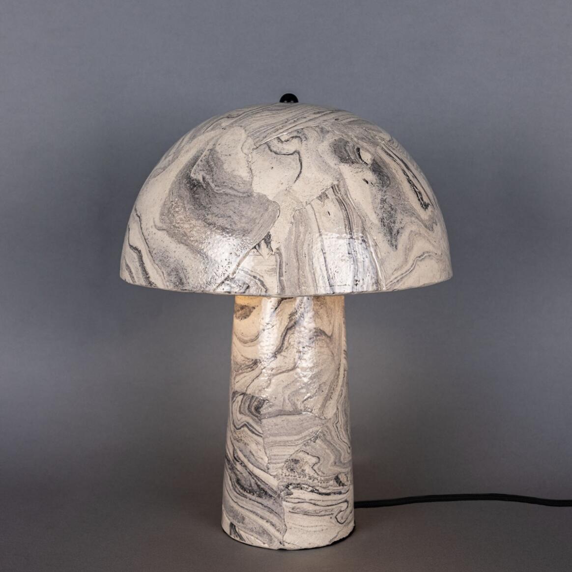Marble-patterned table lamp on a gray background