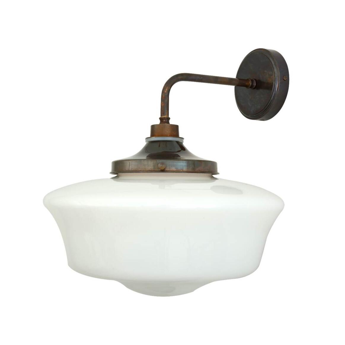 Vintage-style wall-mounted light fixture with white glass shade and bronze metal arm on a white background
