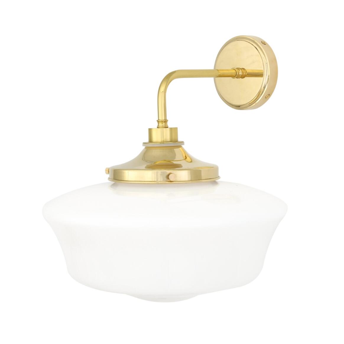 Wall-mounted light fixture with gold finish and white glass shade on a white background