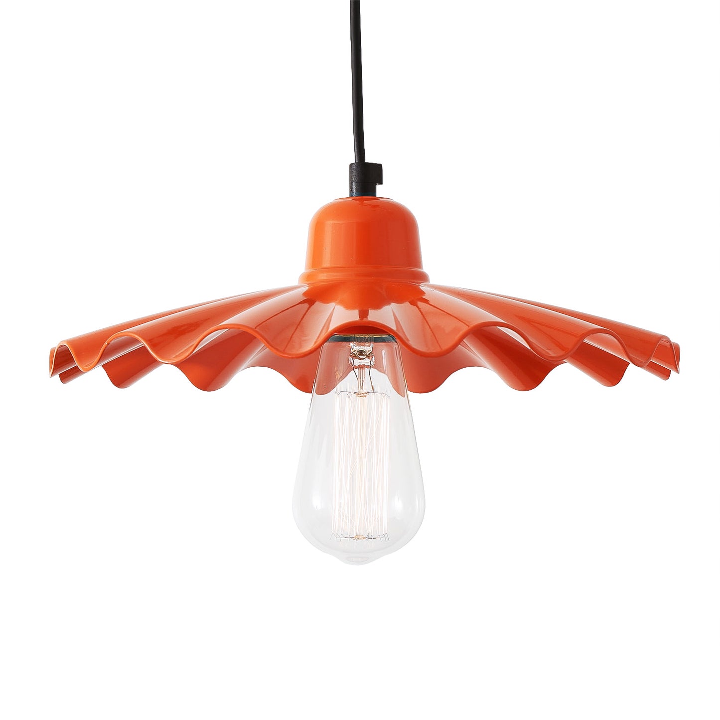 Orange pendant light with a clear bulb on a white background