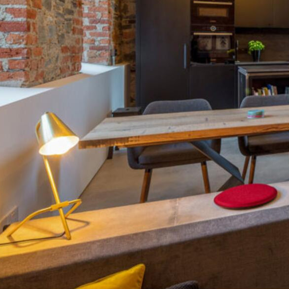 Astana Industrial Adjustable Brass Table Lamp by Mullan Lighting – vintage-style, flexible desk lamp in brass finish, available at Angel Ventures, Mumbai.