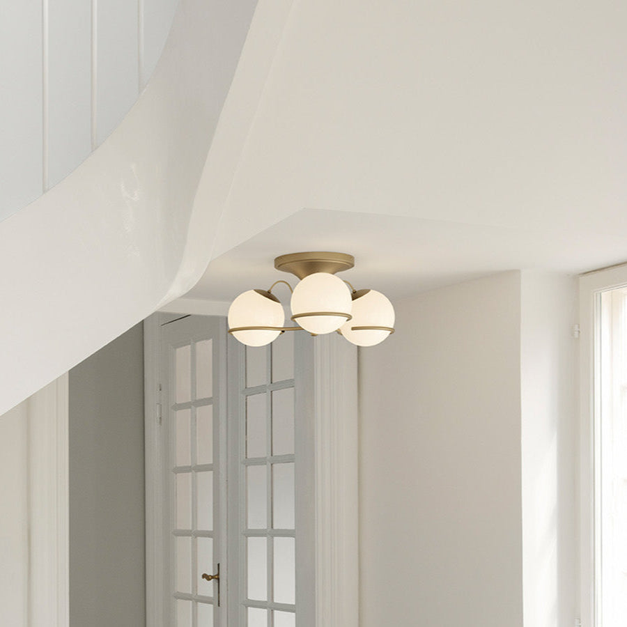 Astep Model 2042/3 Ceiling Lamp with three opaline glass globes mounted on an elegant brass frame, creating soft ambient light and mid-century charm.