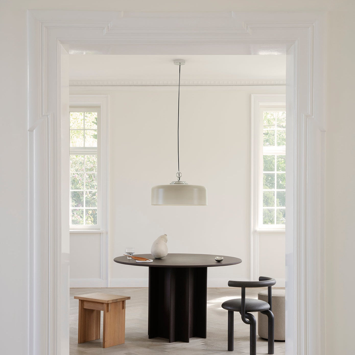 Astep Model 2050 Suspension Lamp featuring a lightweight disc-shaped diffuser in opaline glass, suspended by sleek brass rods for a modern, airy look.