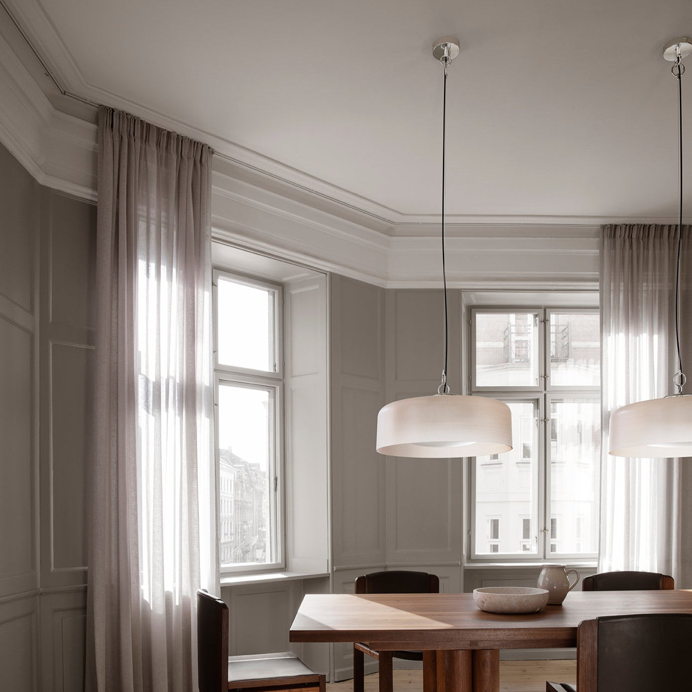 Astep Model 2050 Suspension Lamp featuring a lightweight disc-shaped diffuser in opaline glass, suspended by sleek brass rods for a modern, airy look.