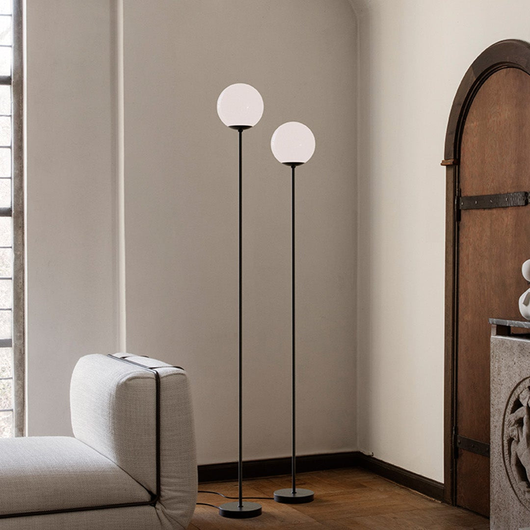Astep Model 1081 Floor Lamp featuring a spherical opaline glass diffuser on a slim metal stand, delivering soft ambient light with mid-century elegance.