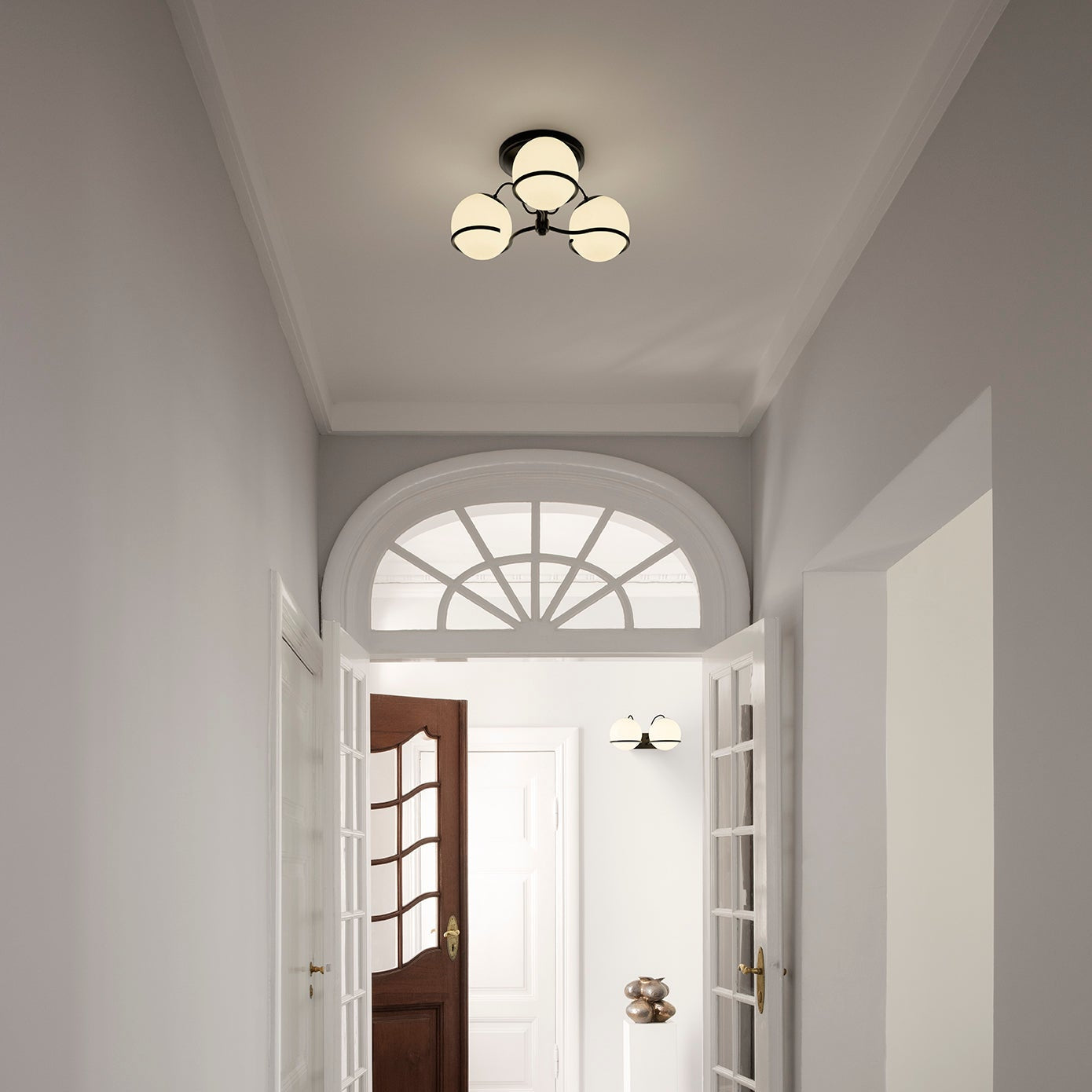 Astep Model 2042/3 Ceiling Lamp with three opaline glass globes mounted on an elegant brass frame, creating soft ambient light and mid-century charm.
