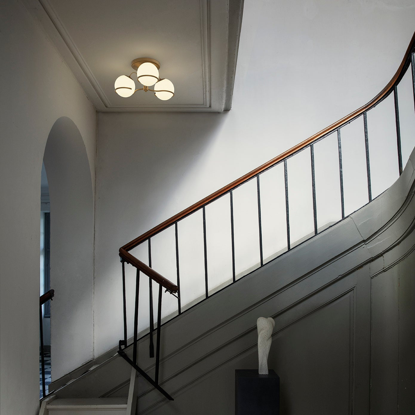 Astep Model 2042/3 Ceiling Lamp with three opaline glass globes mounted on an elegant brass frame, creating soft ambient light and mid-century charm.