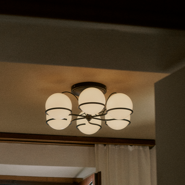 Astep Model 2042/6 Ceiling Lamp featuring six opaline glass globes arranged on an elegant brass frame, delivering mid-century style and soft ambient light.