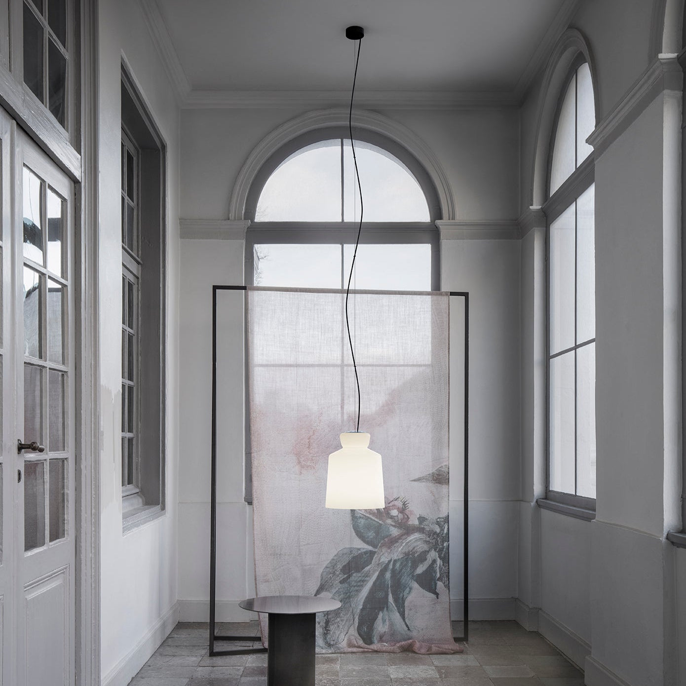 Astep SB Cinquantotto Suspension Lamp with a minimalist opaline glass sphere and sleek metal detailing, delivering soft, diffused ambient light.