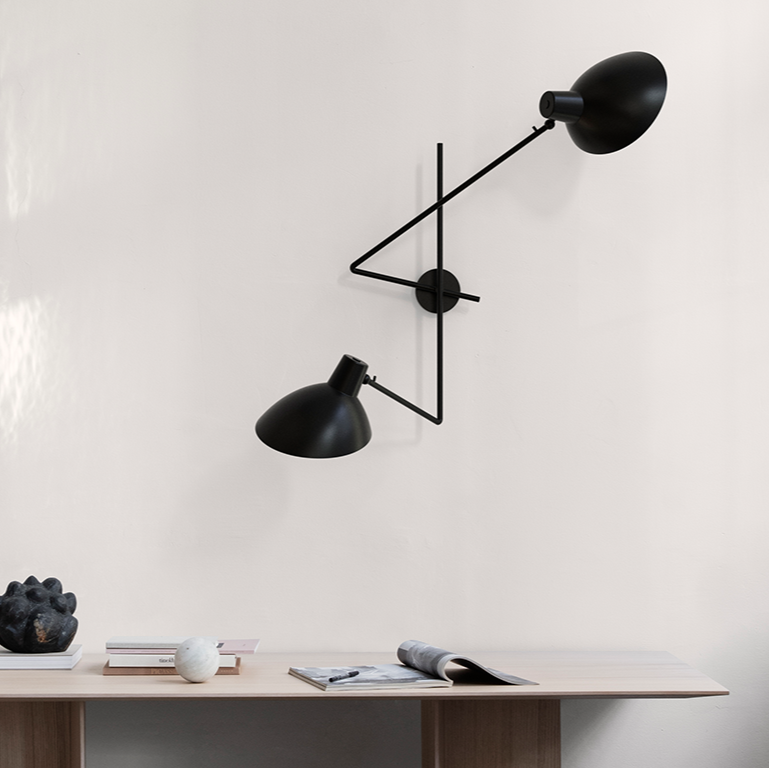 Astep VV Cinquanta Twin wall lamp with two adjustable spun aluminum reflectors on brass arms, combining mid-century elegance with functional lighting.