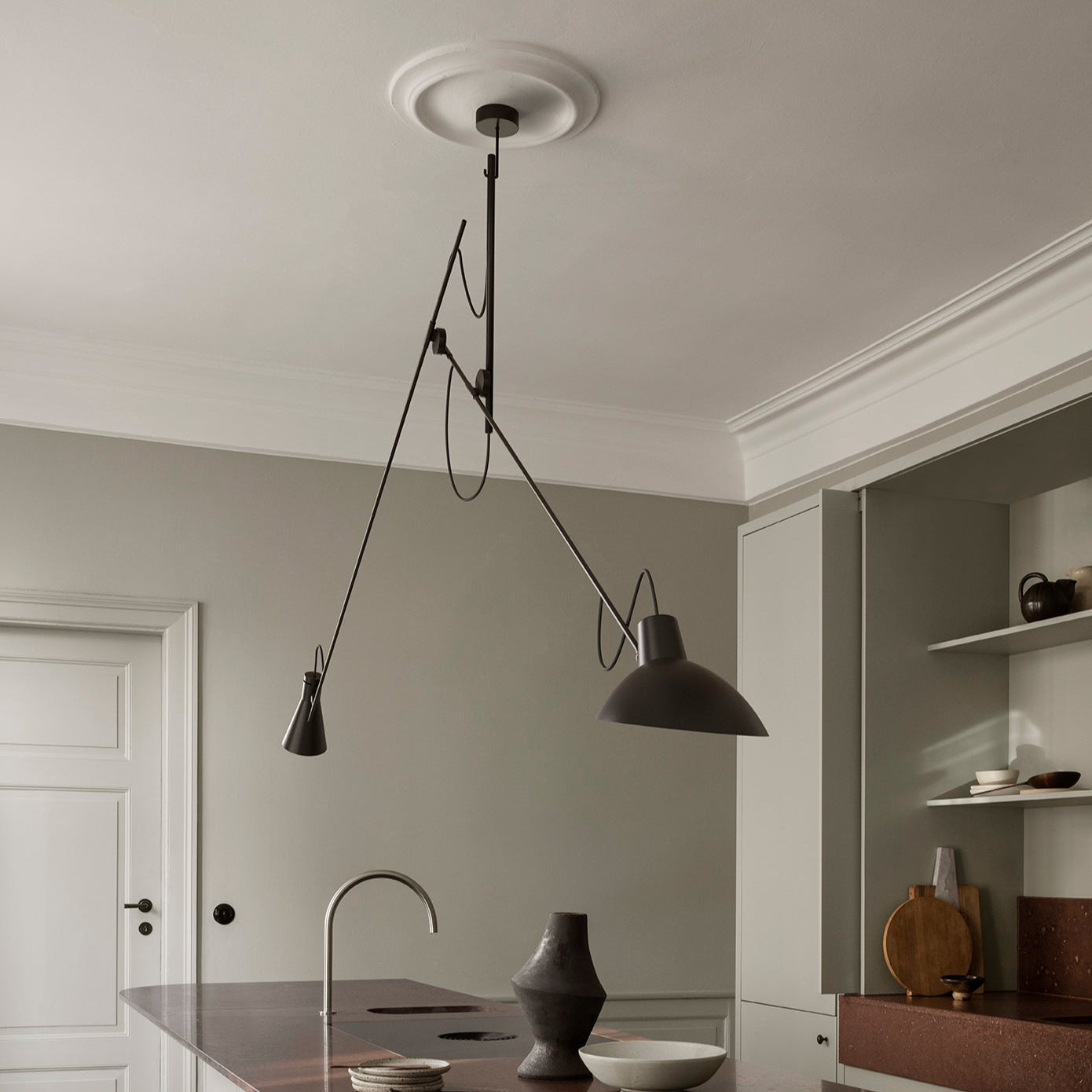 Astep VV Cinquanta Suspension Lamp with an adjustable spun aluminum reflector suspended by a brass rod, blending mid-century design with functional elegance.
