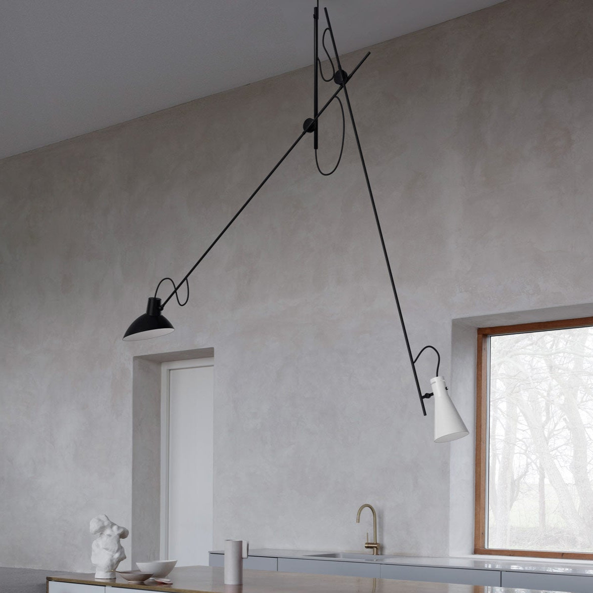 Astep VV Cinquanta Suspension Lamp with an adjustable spun aluminum reflector suspended by a brass rod, blending mid-century design with functional elegance.