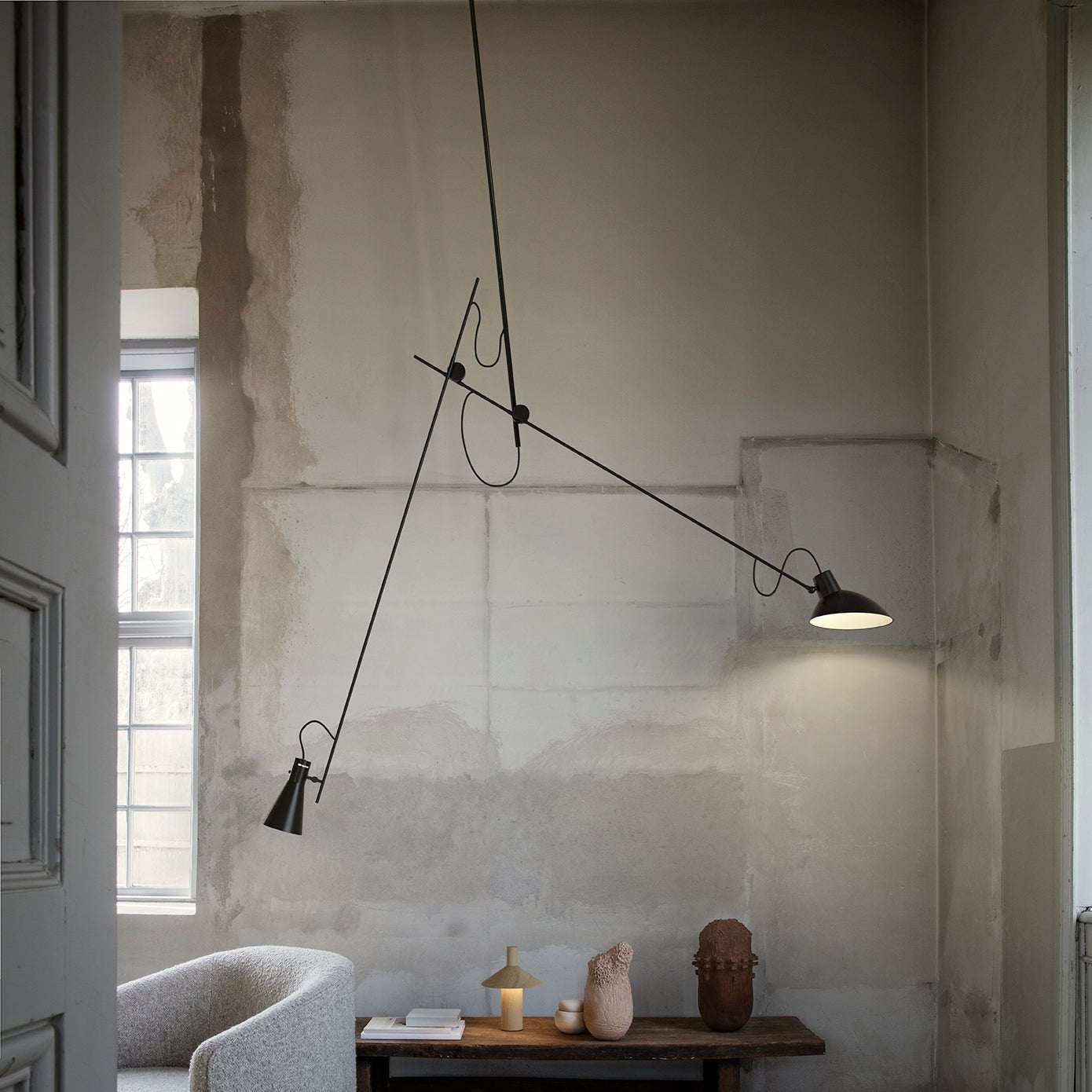 Astep VV Cinquanta Suspension Lamp with an adjustable spun aluminum reflector suspended by a brass rod, blending mid-century design with functional elegance.