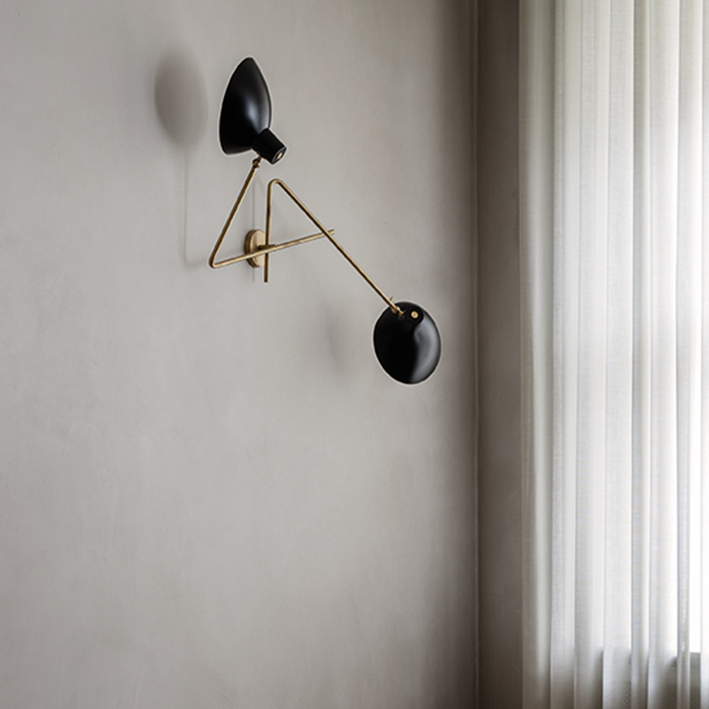 Astep VV Cinquanta Twin wall lamp with two adjustable spun aluminum reflectors on brass arms, combining mid-century elegance with functional lighting.