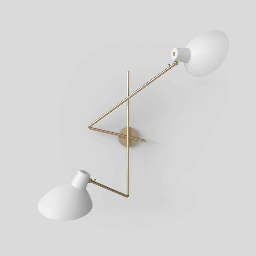 Astep VV Cinquanta Twin wall lamp with two adjustable spun aluminum reflectors on brass arms, combining mid-century elegance with functional lighting.