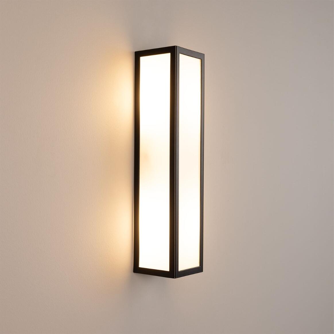 Wall-mounted light fixture on a plain wall