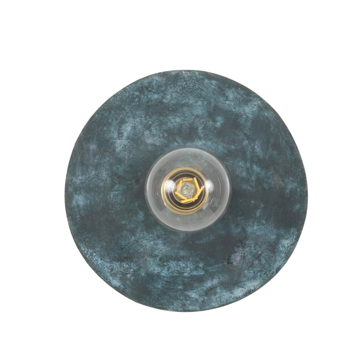 Round blue marble-patterned object with a clear center on a white background