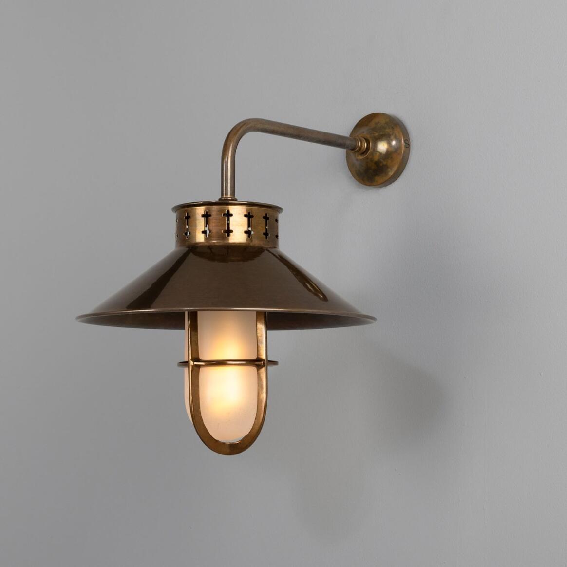 Boyd Wall Lamp by Mullan Lighting featuring a bold brass construction with industrial design elements, ideal for accenting hallways, bedrooms, or living areas