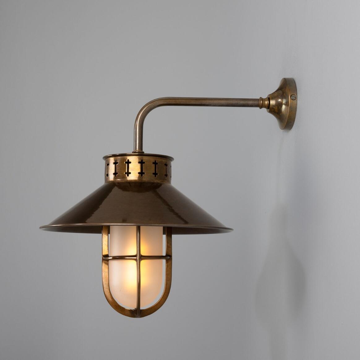 Boyd Wall Lamp by Mullan Lighting featuring a bold brass construction with industrial design elements, ideal for accenting hallways, bedrooms, or living areas