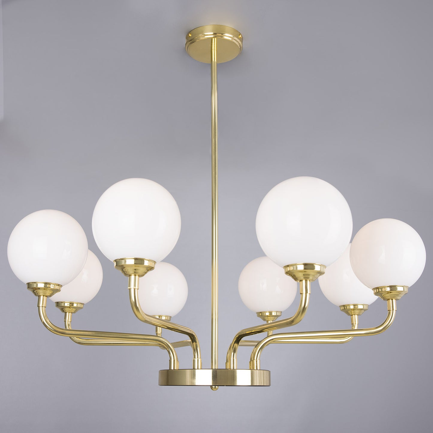 Branford Opal Globe Chandelier by Mullan Lighting with multiple opal glass globes, elegant chandelier design, and warm ambient lighting for sophisticated interiors